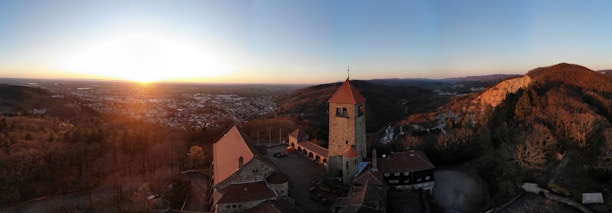 A scenic view of the Szigliget castle courtyard at sunset, highlighting Bahia’s real estate work.