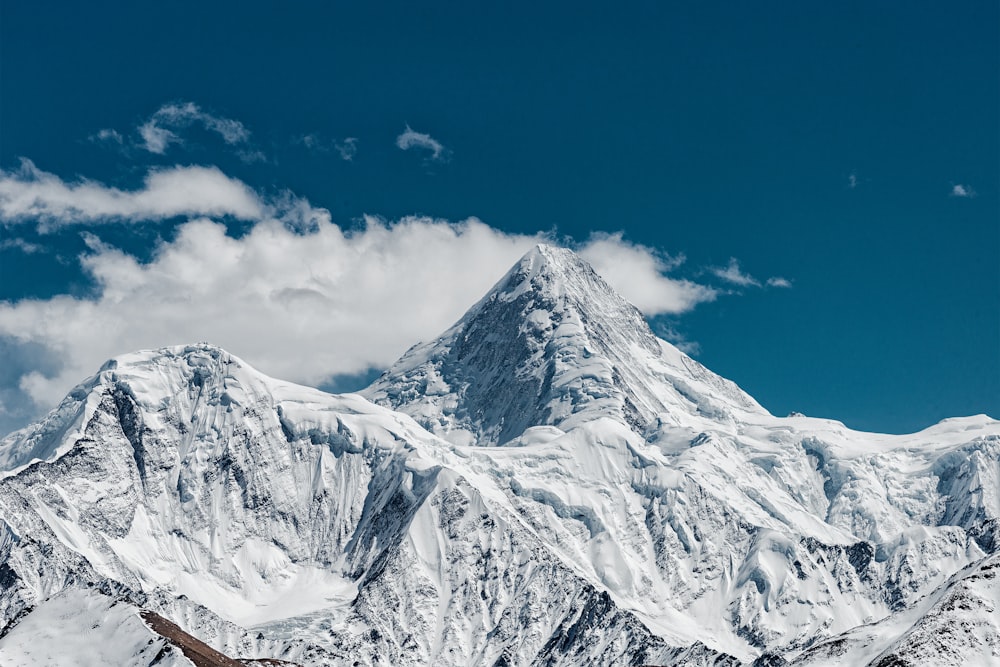 snow covered mountain under blue sky during daytime