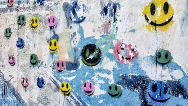 Illustration of a colorful mood chart with smiley and neutral faces.