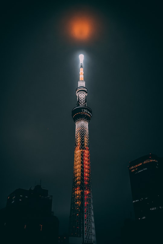 red and white tower during night time in Tōkyō−Tower Japan