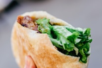 Close-up of frozen pita bread and kebab ingredients neatly packed in a refrigerated box.