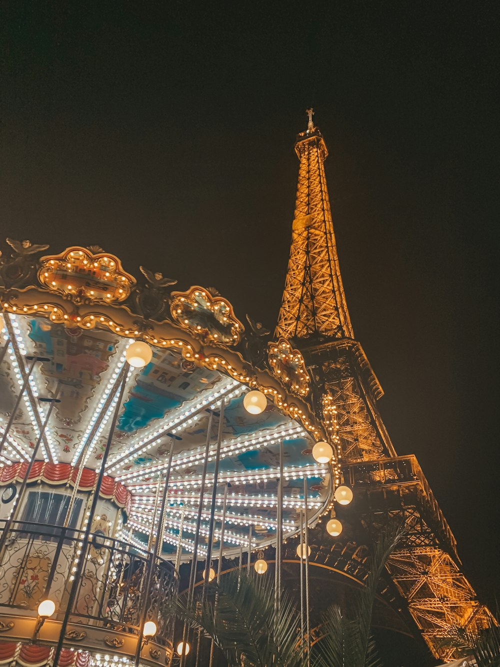 blue and yellow lighted carousel during night time