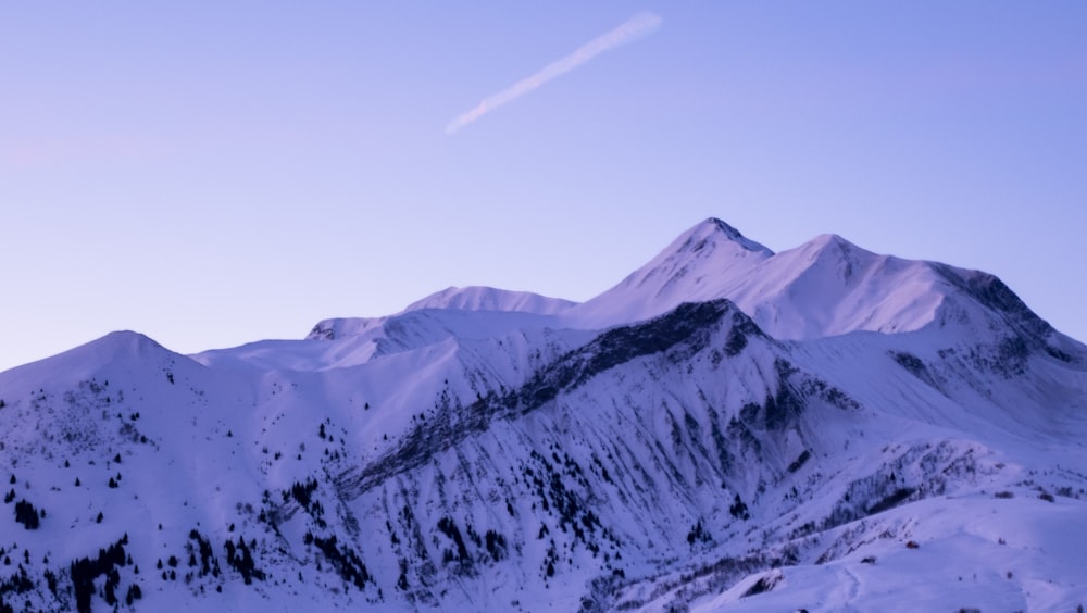 snow covered mountain under blue sky during daytime