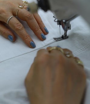 person wearing silver ring and gold ring