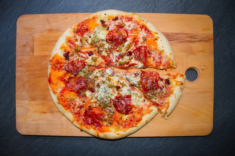 pizza on brown wooden table