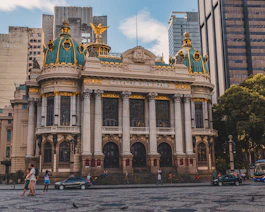 a large building with a gold and blue roof