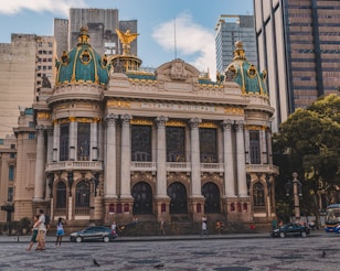 a large building with a gold and blue roof