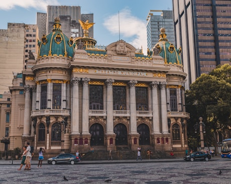 a large building with a gold and blue roof