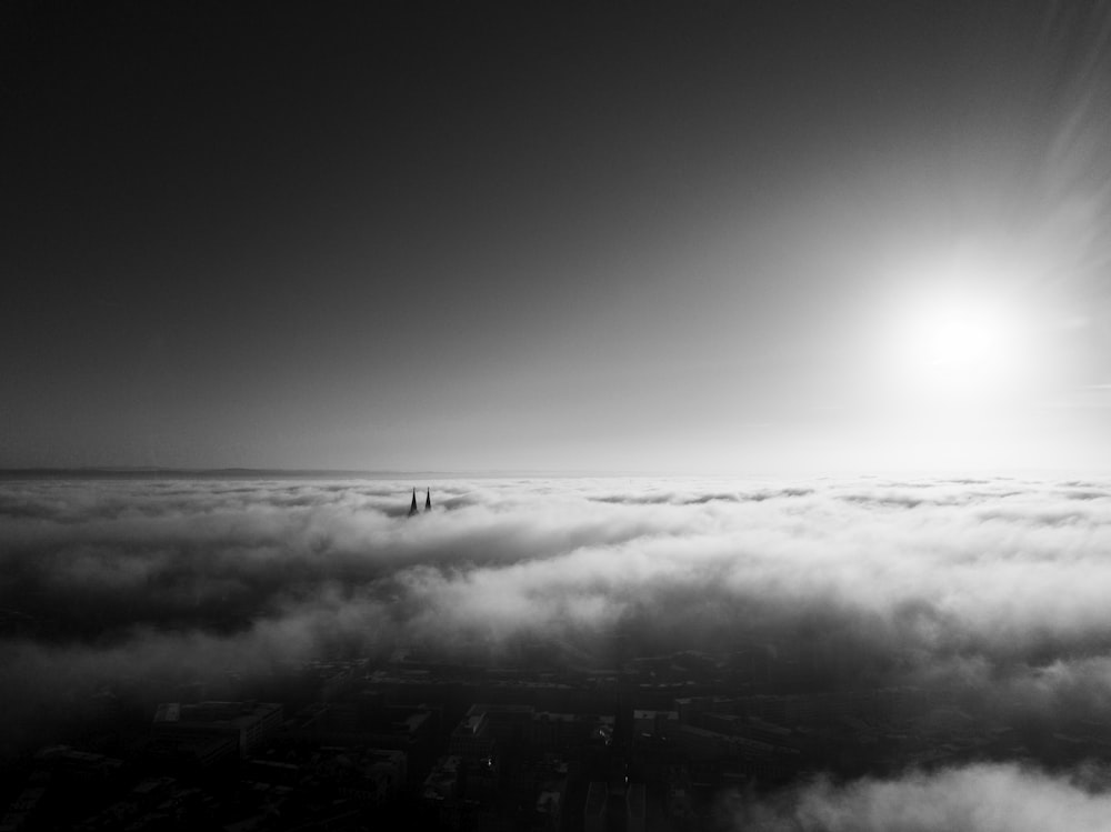 grayscale photo of clouds over the sea