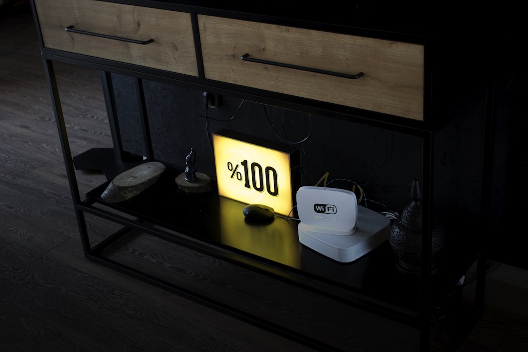 a table that has a light on top of it, By Ekin