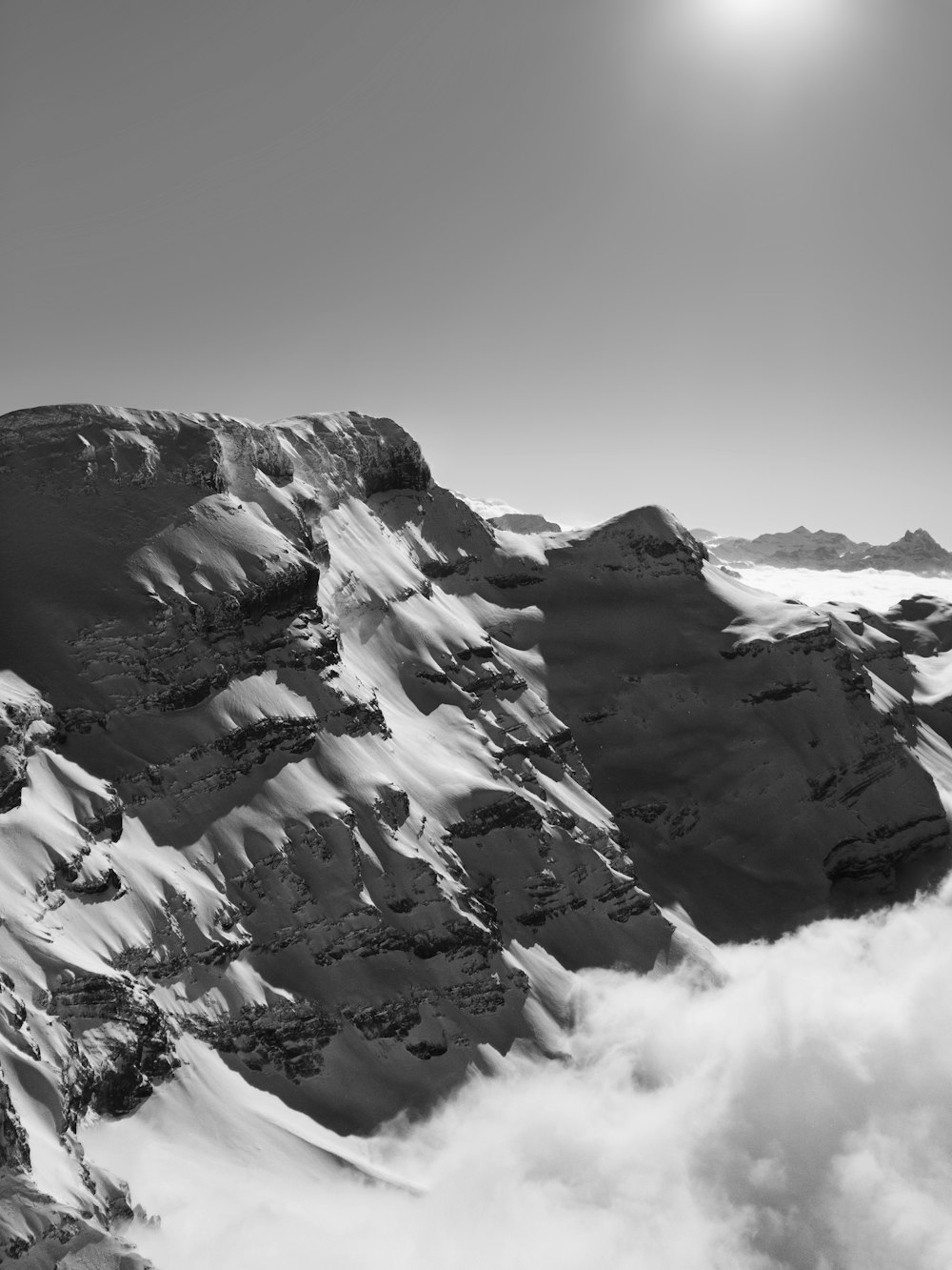 grayscale photo of snow covered mountain