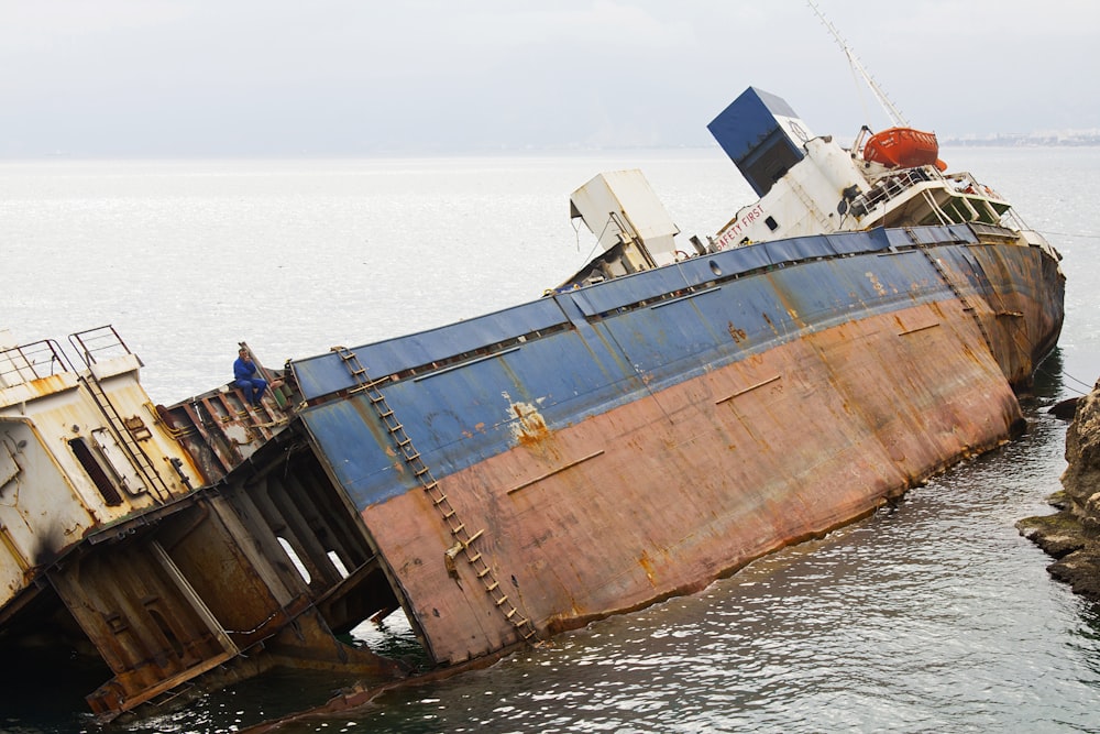 brown and white ship on sea during daytime