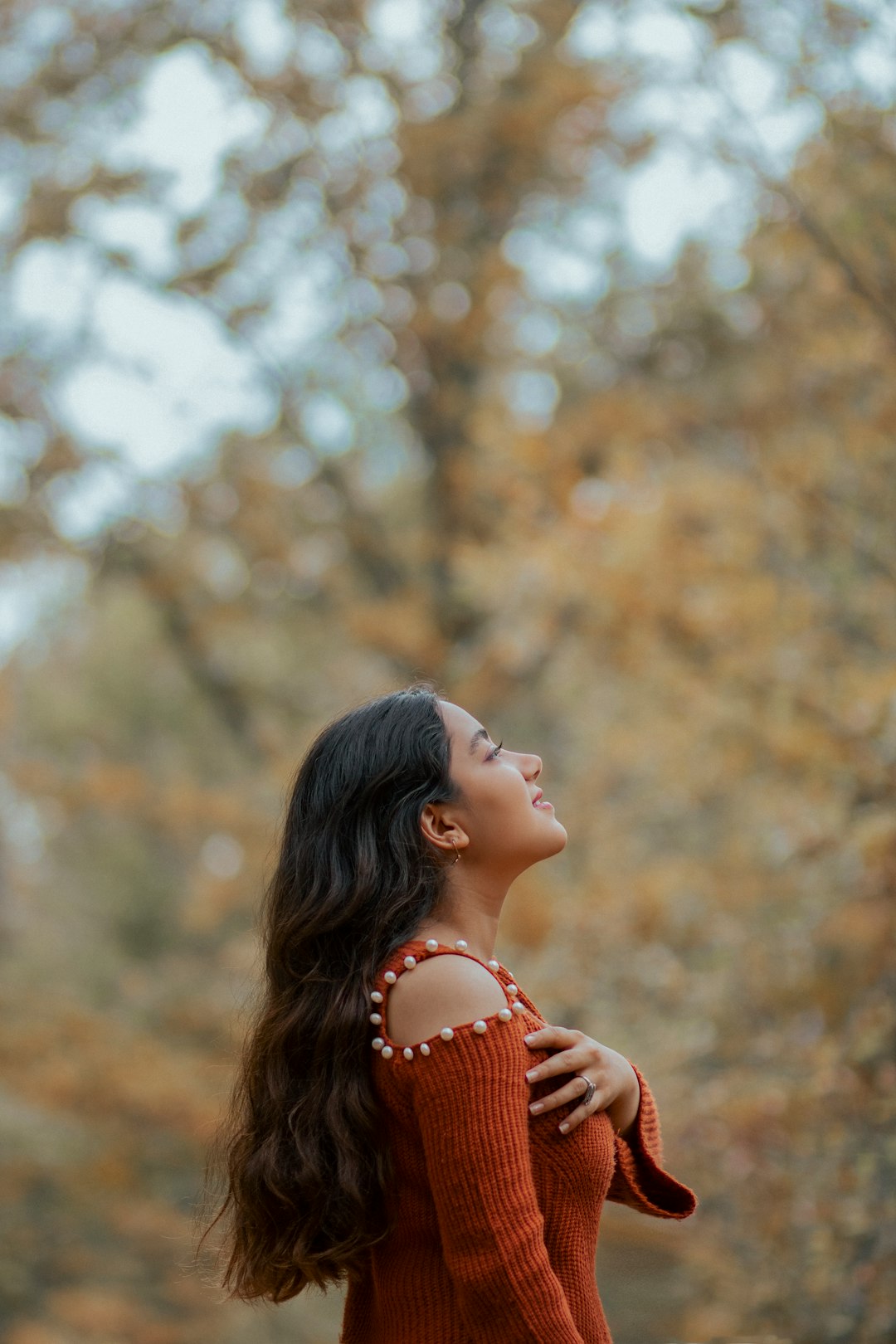 woman in orange and white stripe shirt