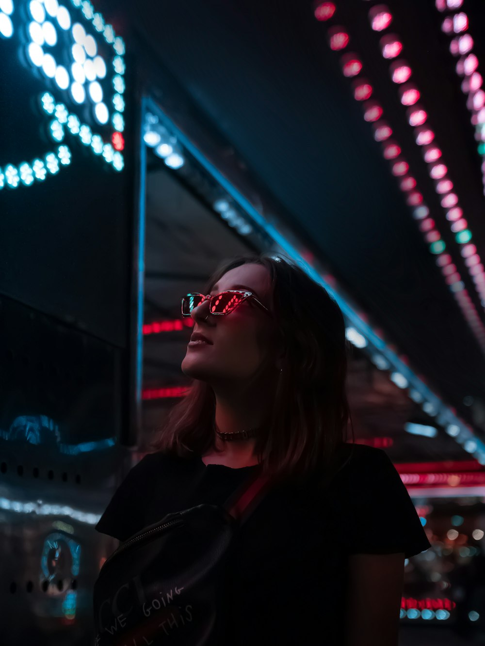 woman in black coat wearing sunglasses