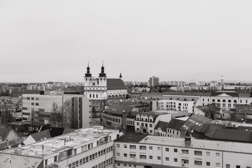 grayscale photo of city buildings