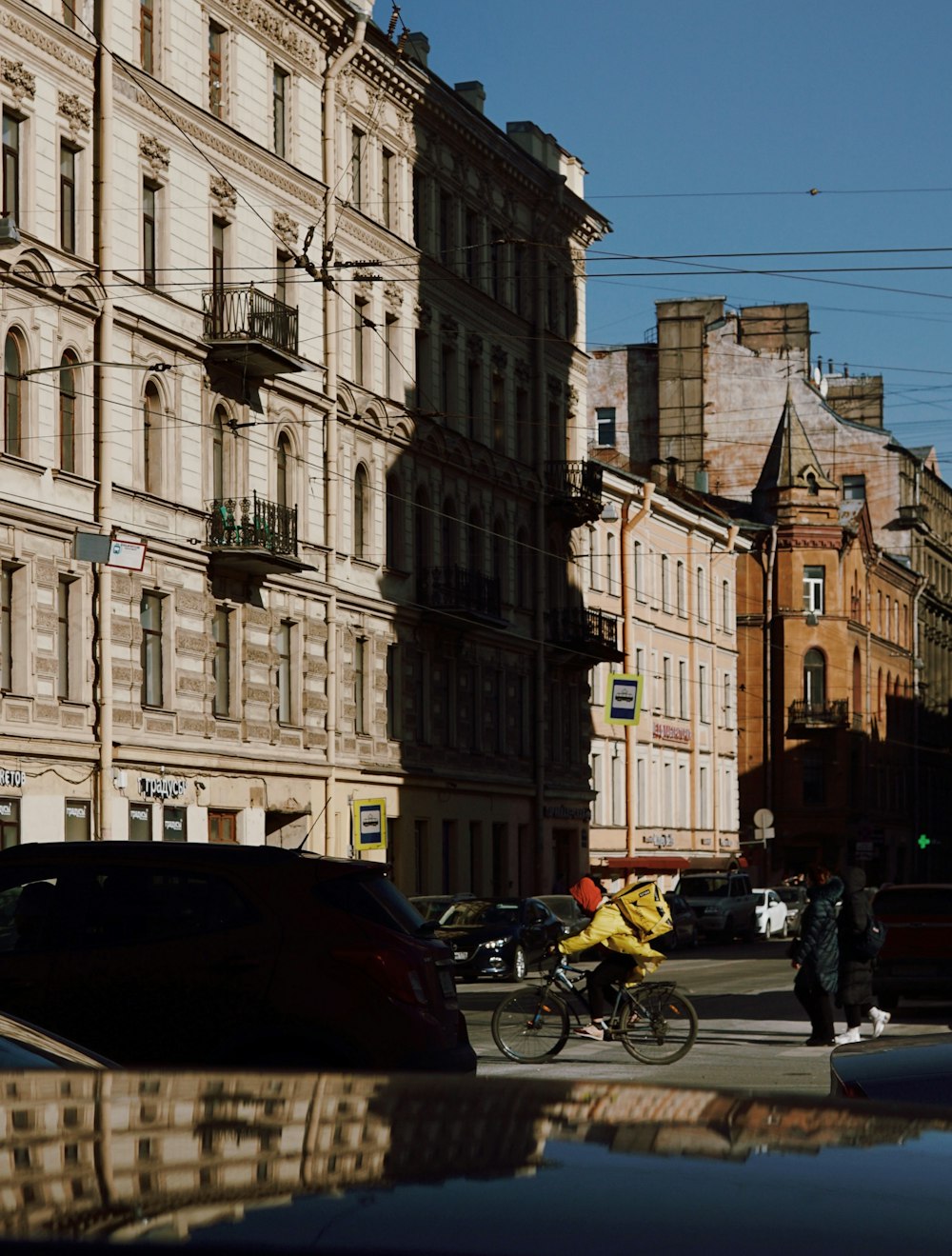 people walking on street near beige concrete building during daytime