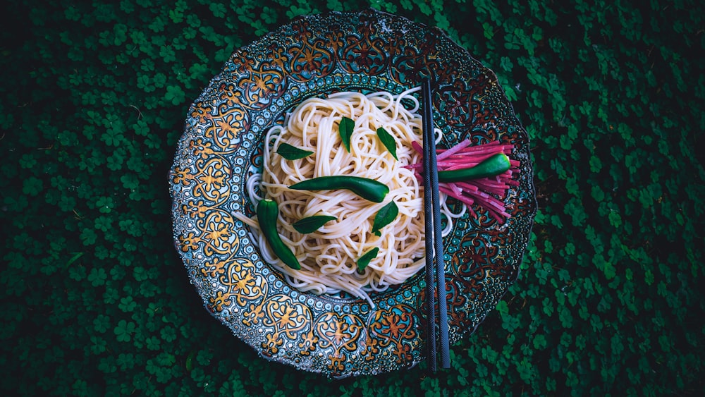 green and white vegetable on blue and white ceramic plate