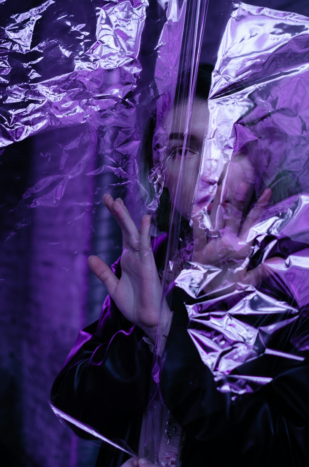 grayscale photo of person holding plastic bag