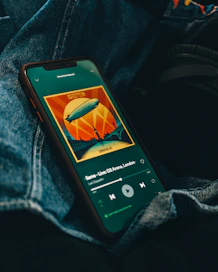 black iphone 5 on blue denim textile