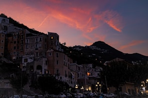 Evening sky casting warm hues over the village rooftops.