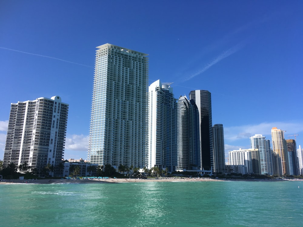 city skyline across body of water during daytime