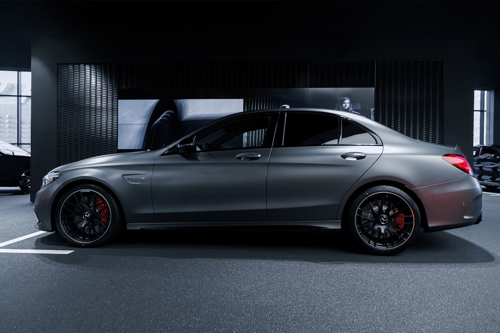 black coupe in a dark room