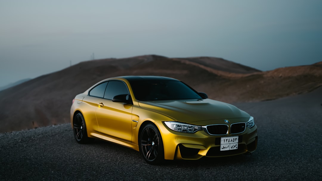 yellow mercedes benz coupe on road during daytime