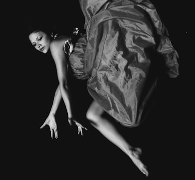A dynamic shot of a model mid-motion, with flowing fabric creating a sense of movement.