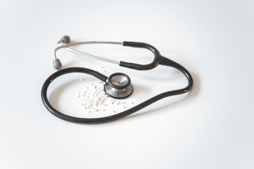 black and silver stethoscope on white surface at at hisar institute of nursing