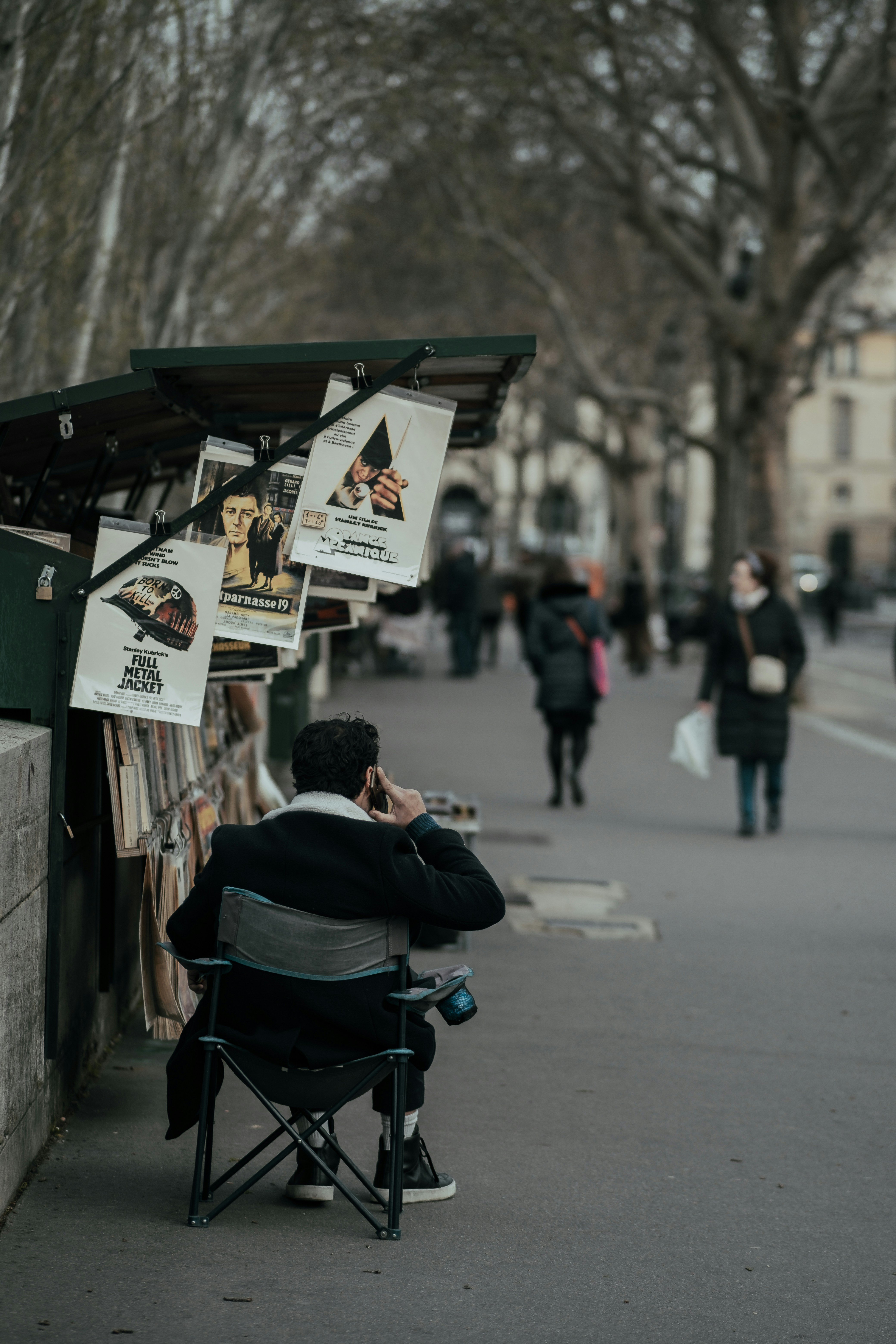 man in blue jacket sitting on wheelchair