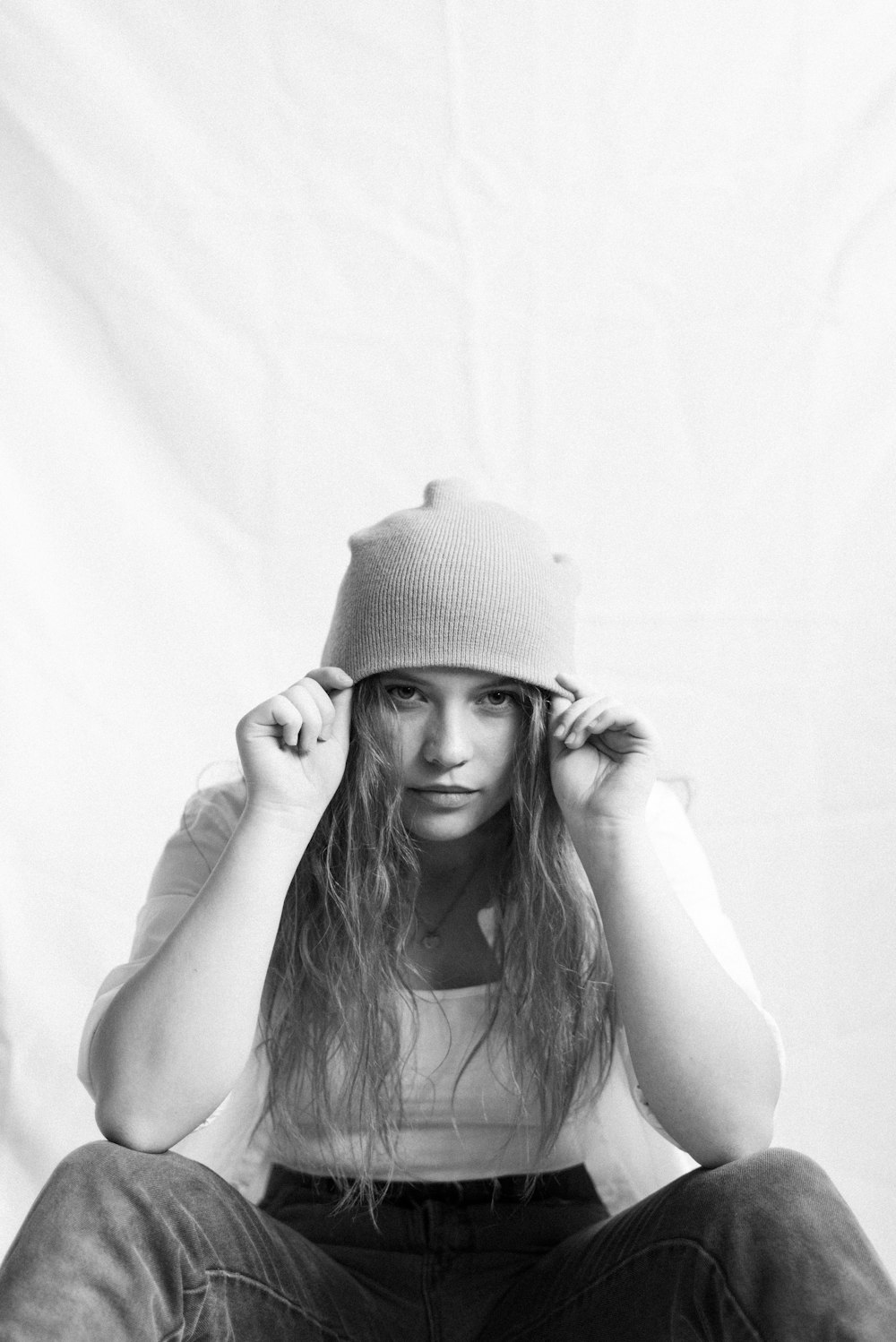 grayscale photo of woman wearing knit cap