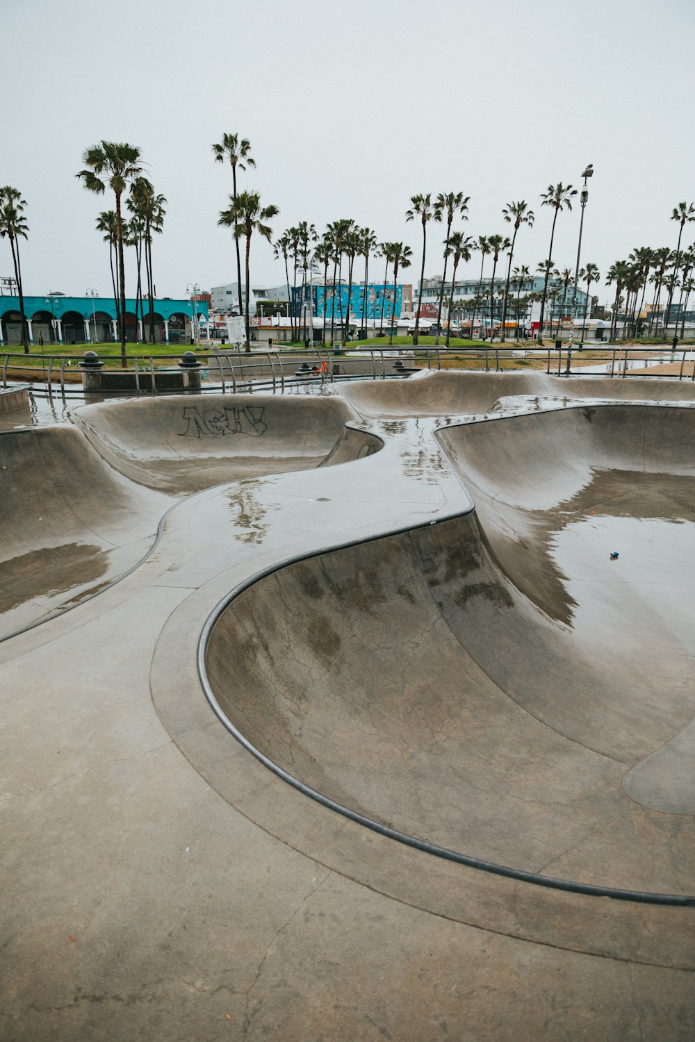 gray concrete road with water fountain