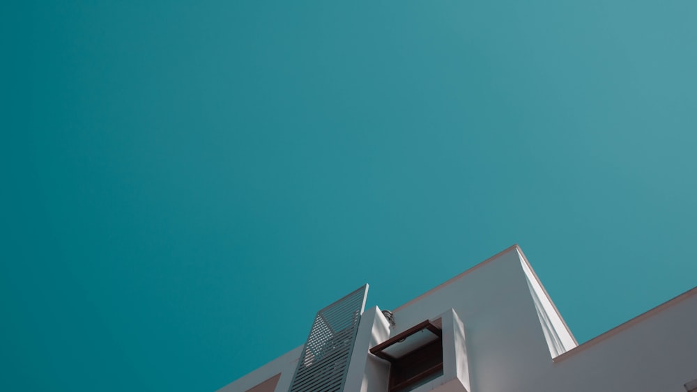 white concrete building under blue sky during daytime