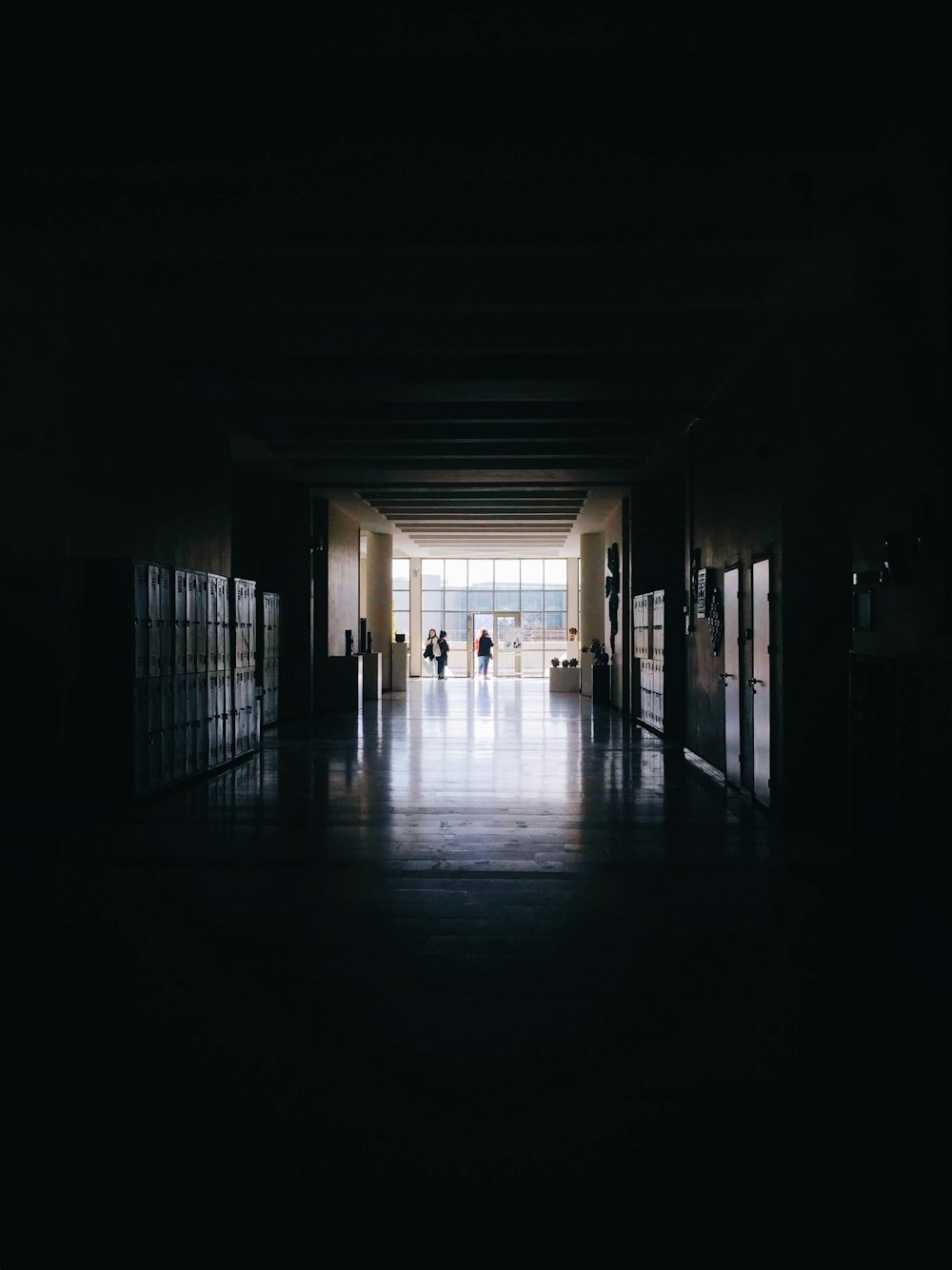 silhouette of person walking on hallway