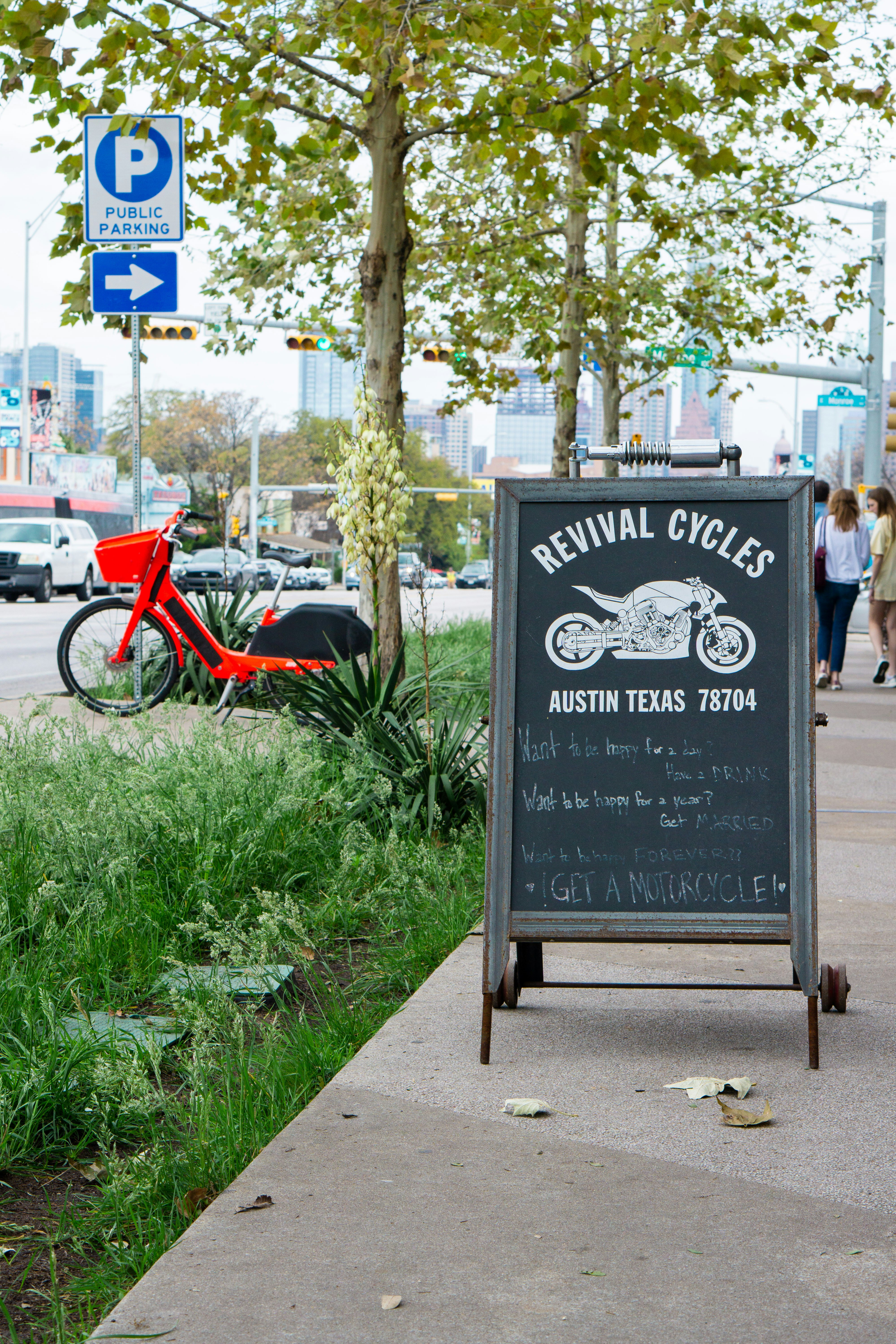 black and white bicycle parked on sidewalk during daytime