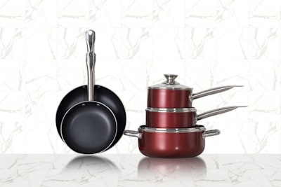 red and black cooking pots pans teams background