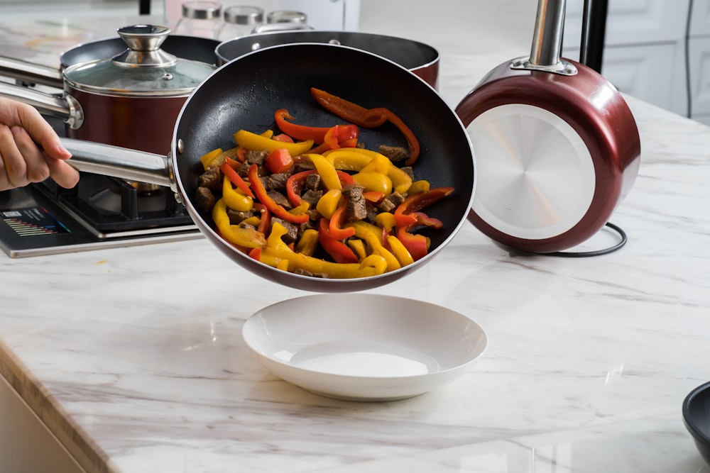 sliced fruits on black frying pan