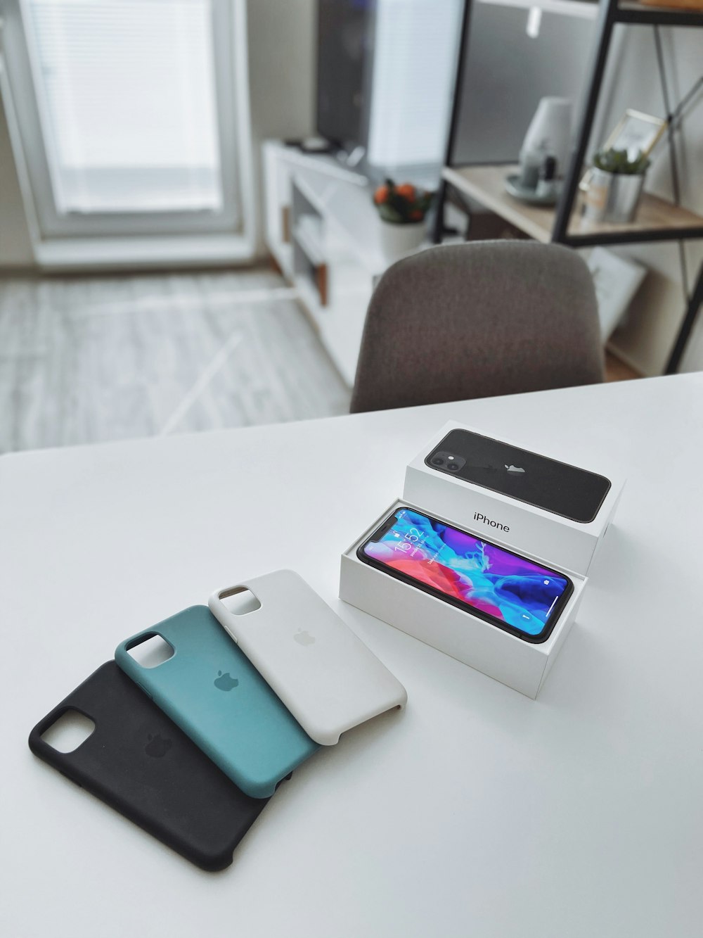 silver iphone 6 on white table