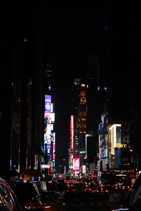 An energetic street scene in Lagos at night, filled with lively crowds and colorful lights.