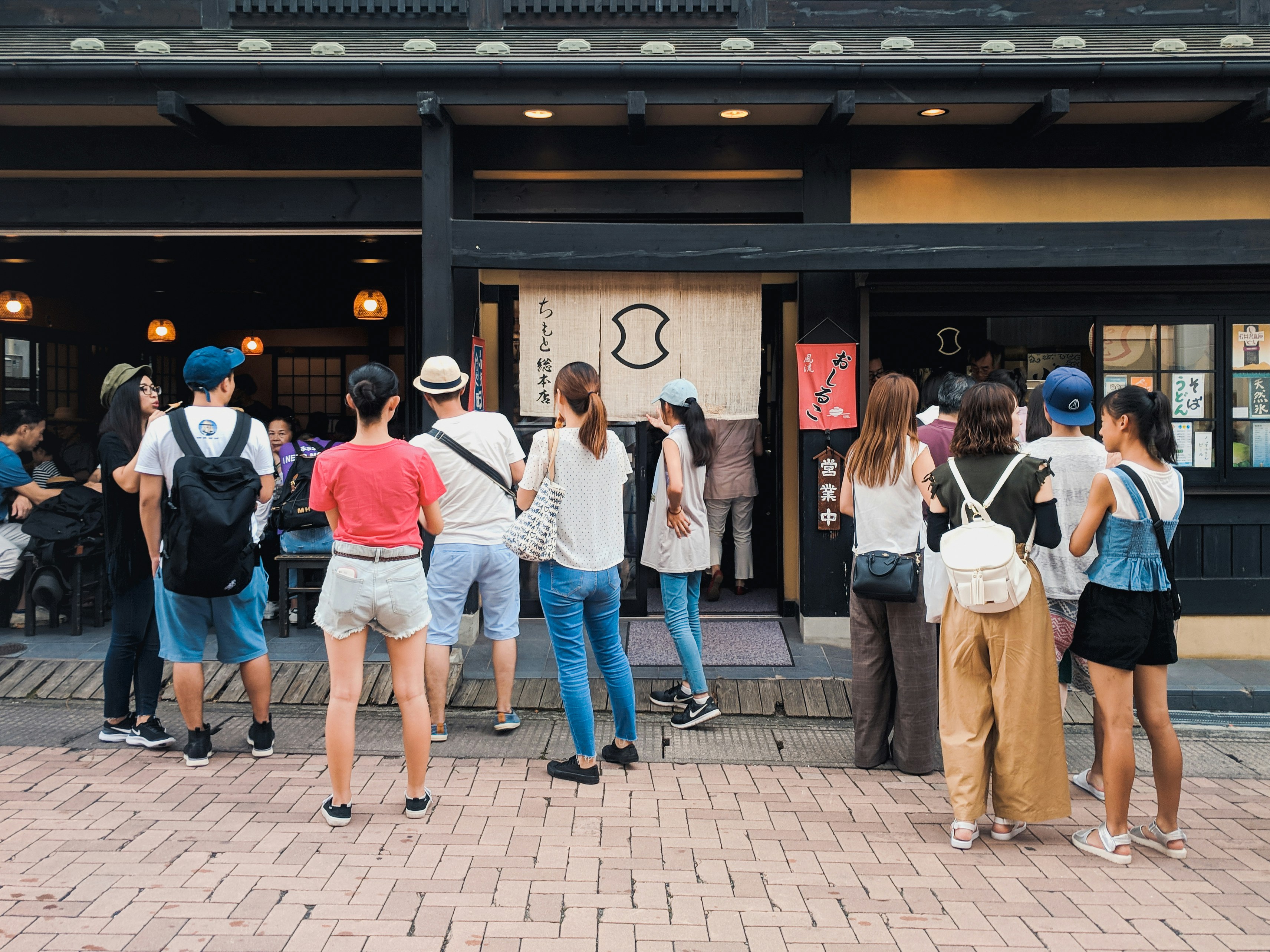people walking on sidewalk during daytime