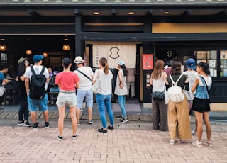 people walking on sidewalk during daytime