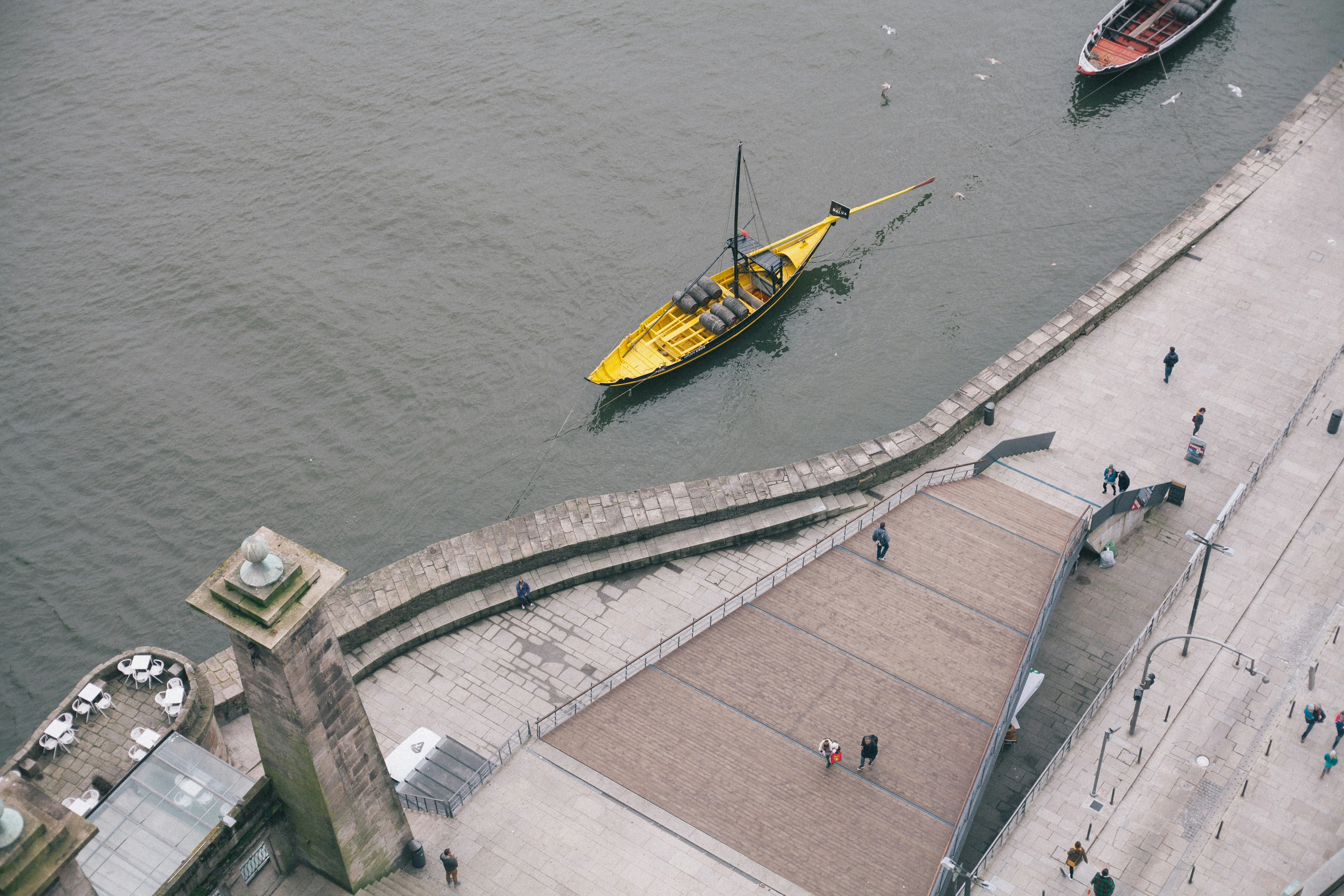 yellow and black boat on body of water during daytime