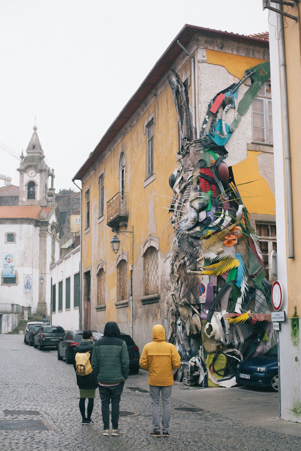 people sitting on street in front of building during daytime