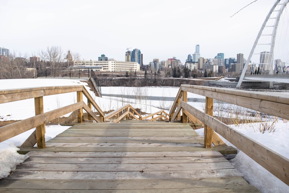 brown wooden dock on body of water during daytime