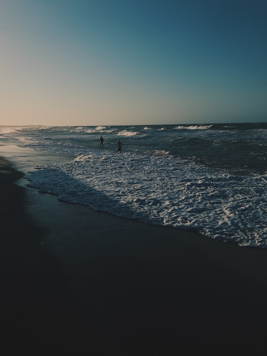 people on beach during daytime in Camocim Brasil