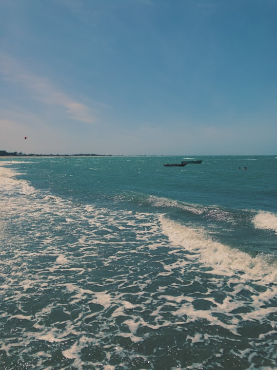 people surfing on sea during daytime in Cajueiro da Praia Brasil