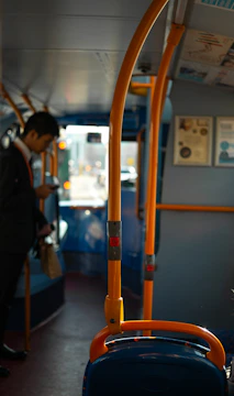 Phone frame displaying a vibrant bus driving simulation with detailed interiors.
