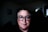 man in black crew neck shirt wearing black framed eyeglasses