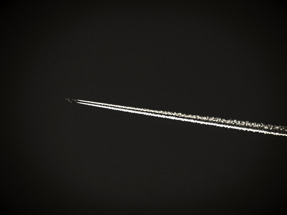 black and white plane on black background photo – Free Sky Image on Unsplash