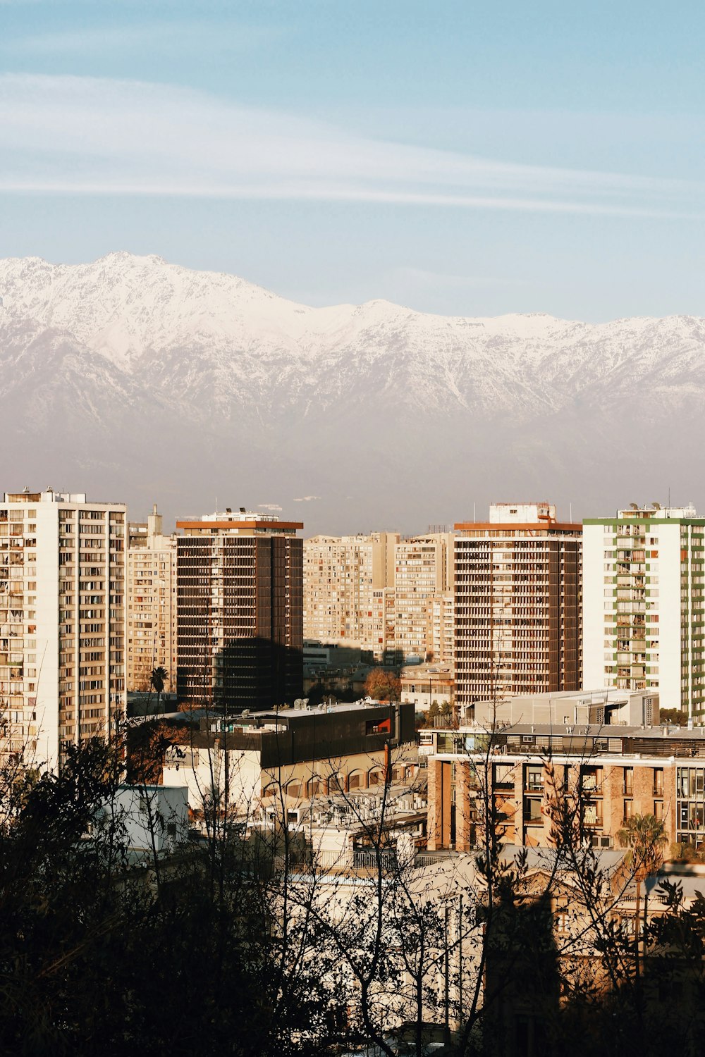 city buildings near mountain during daytime